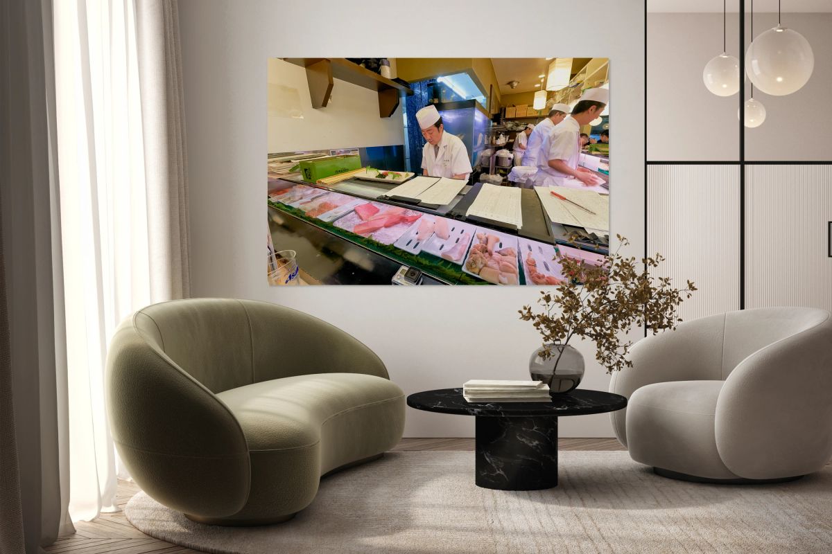 Sushi chefs preparing fresh dishes in Shibuya district of Tokyo
