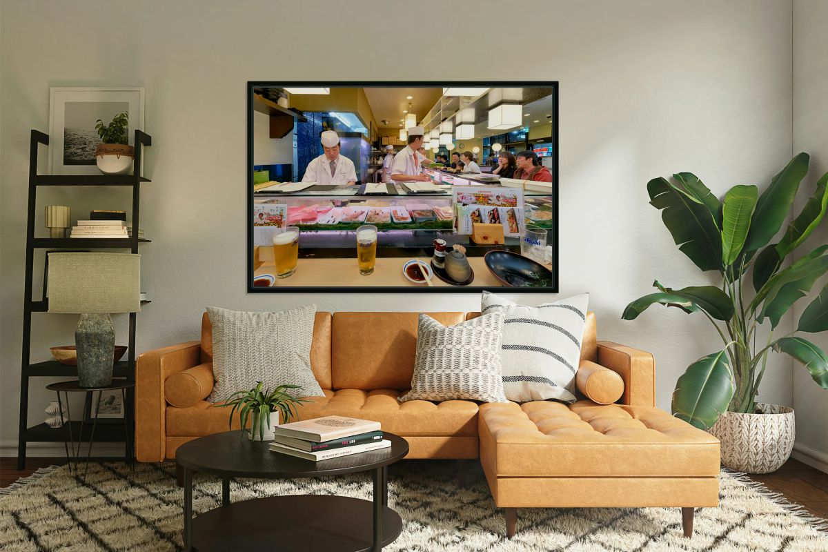 Sushi bar in Shibuya district with chefs and guests enjoying mea