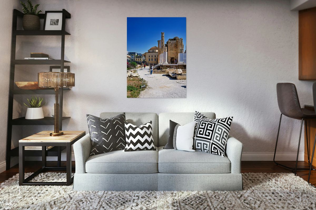 Visitors explore Hadrians Library in Athens Greece under clear