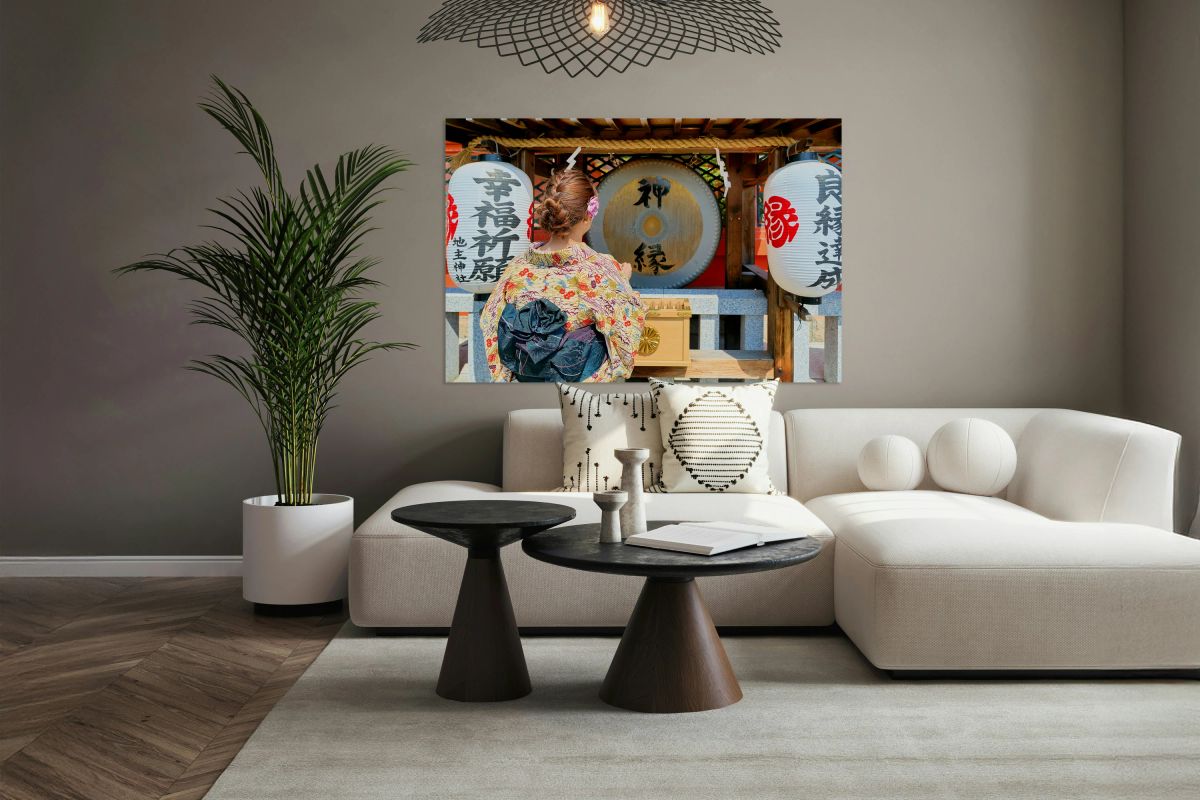 Young woman prays at Kiyomizu Dera Temple in Kyoto Japan