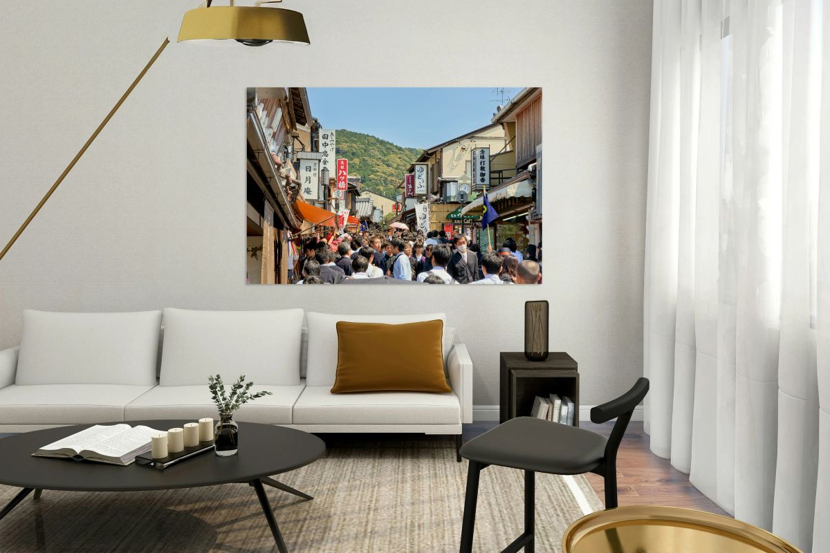 Crowds explore the Higashiyama district in Kyoto Japan on a sun