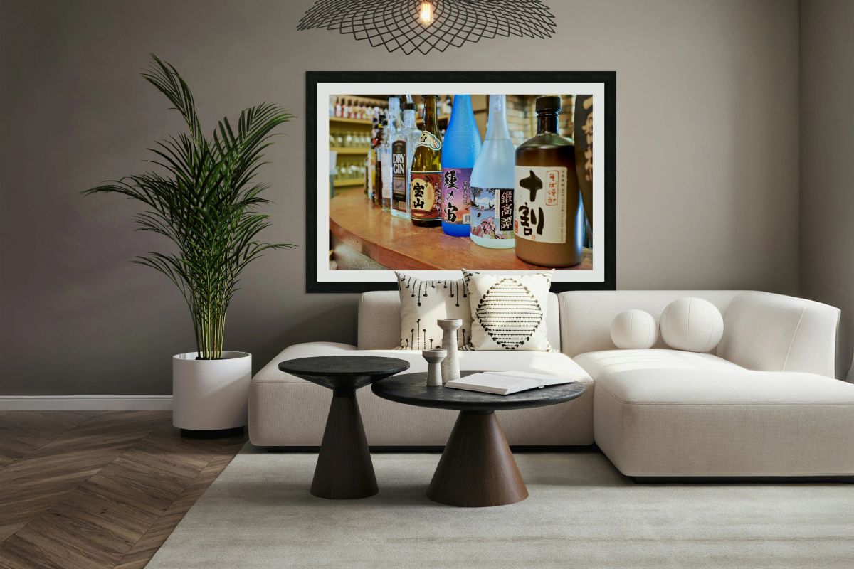 Sake bottles displayed on a counter in Kyoto Japan
