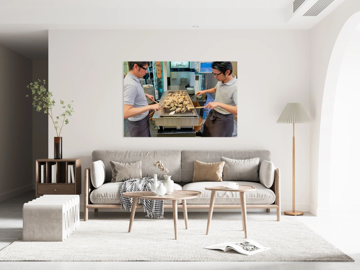 Grilling oysters at a restaurant in Miyajima Hiroshima Japan