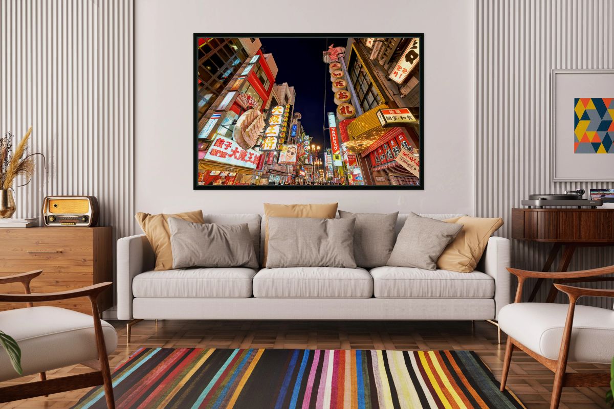 Illuminated signboards in Dotonbori District during sunset in Os