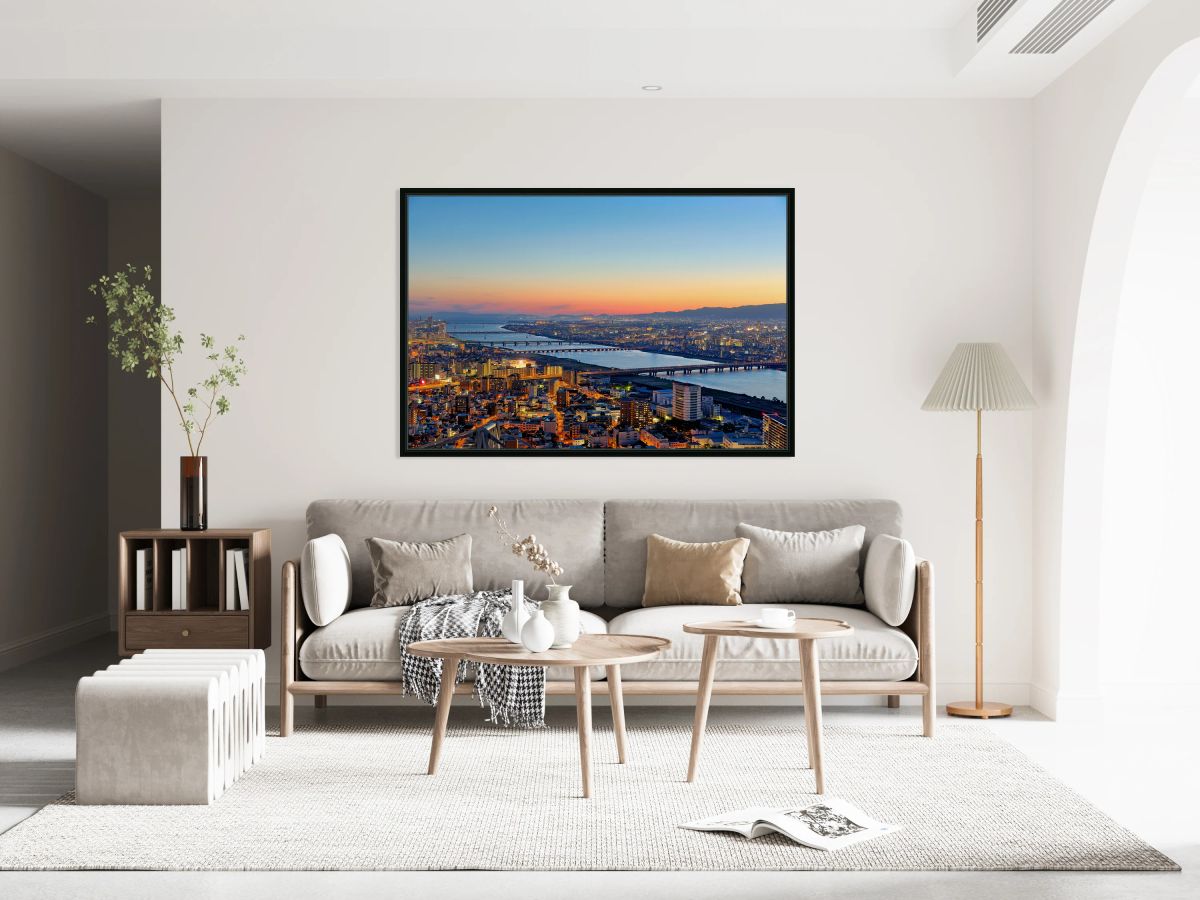 View of Yodo river in Osaka at sunset with city structures and r