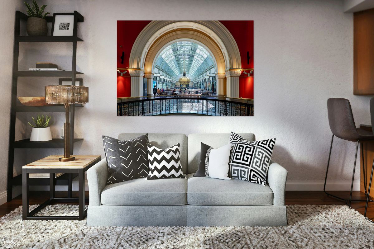 Elegant interior of a shopping arcade with people dining.