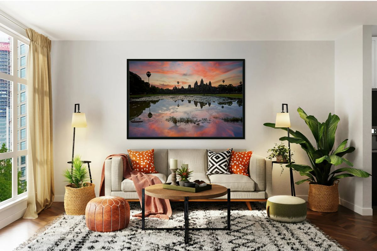 Stunning Angkor Wat sunset reflection over lily pond.