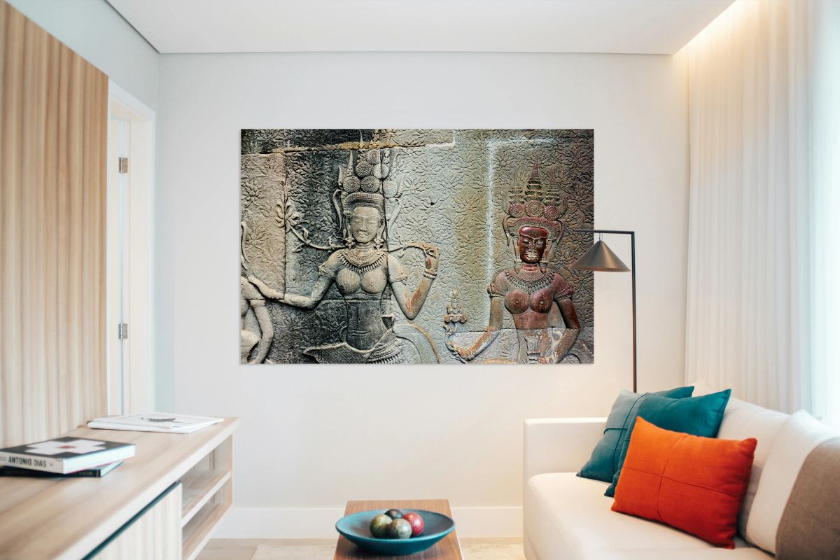 Ancient Khmer temple bas relief carvings of celestial dancers.