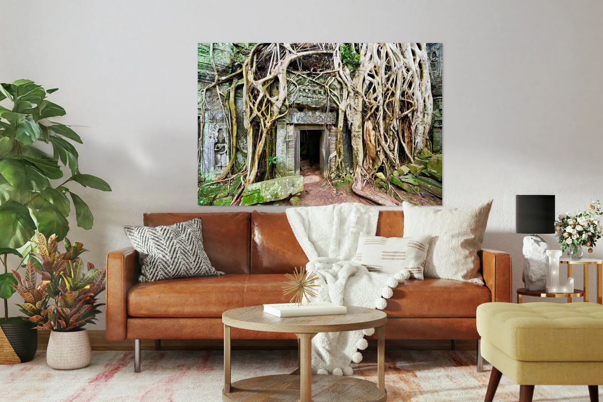 Ancient temple ruins overgrown by massive tree roots.