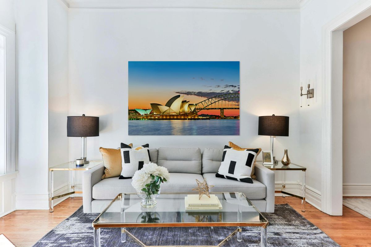 Sydney Opera House and Harbour Bridge at sunset.