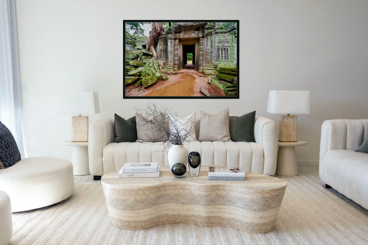 Ancient temple ruins overgrown by trees and moss.