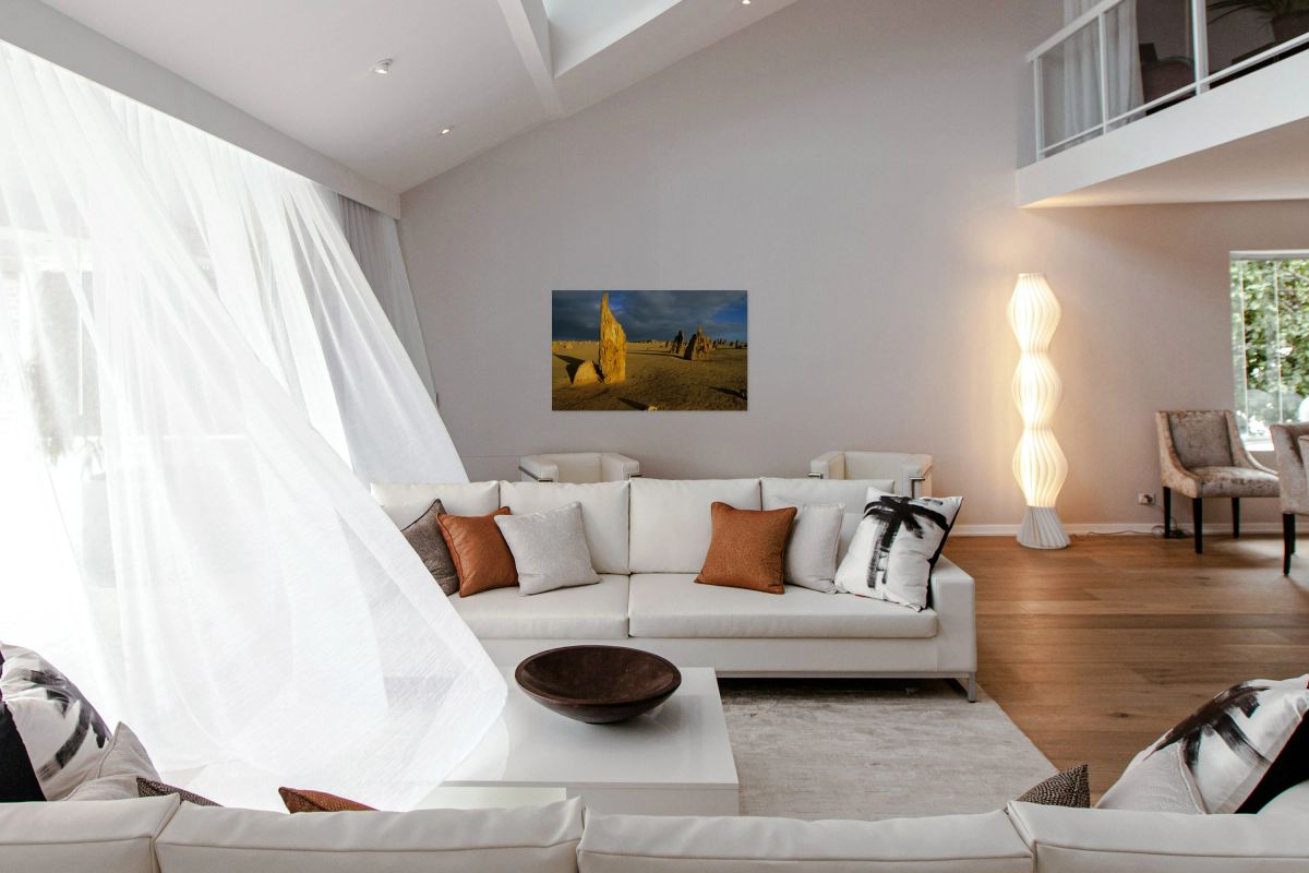 Pinnacles desert landscape at sunset with dramatic clouds.