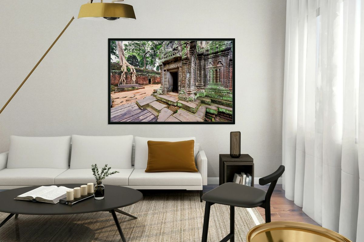 Angkor temple ruins consumed by nature.