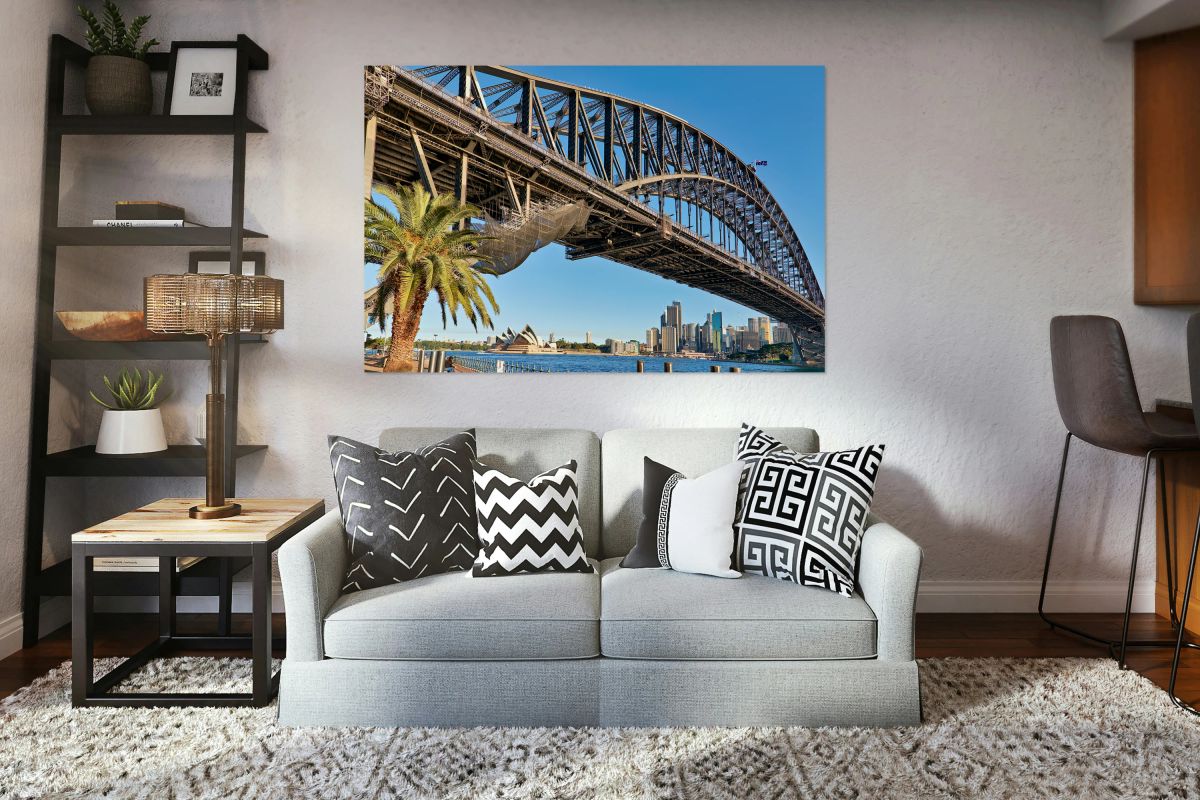 Sydney Harbour Bridge and Opera House with palm tree.