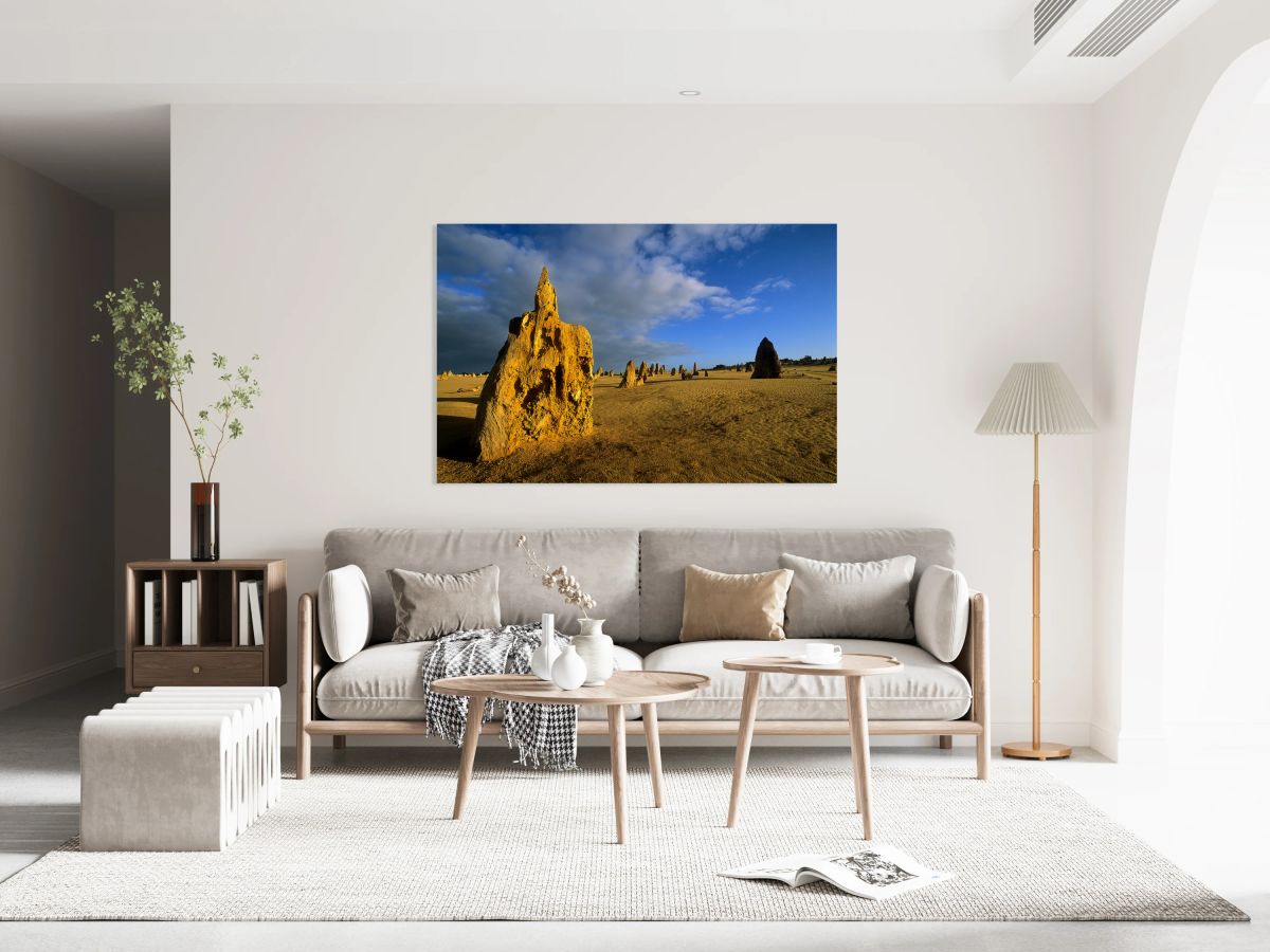 Golden limestone pinnacles in the Australian desert at sunset.
