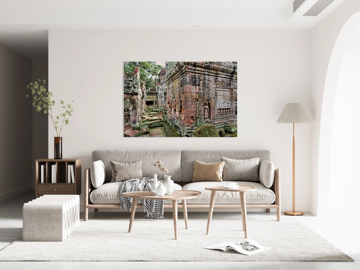 Moss covered ancient temple ruins with detailed carvings and sta