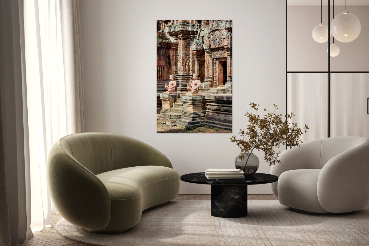 Ancient Cambodian temple with intricate carvings and guardian st