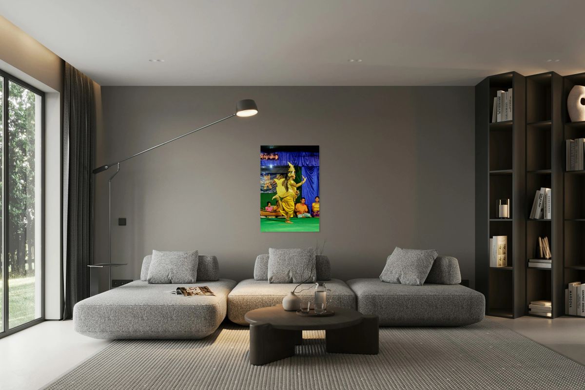 Girl performs traditional Cambodian dance in golden costume.