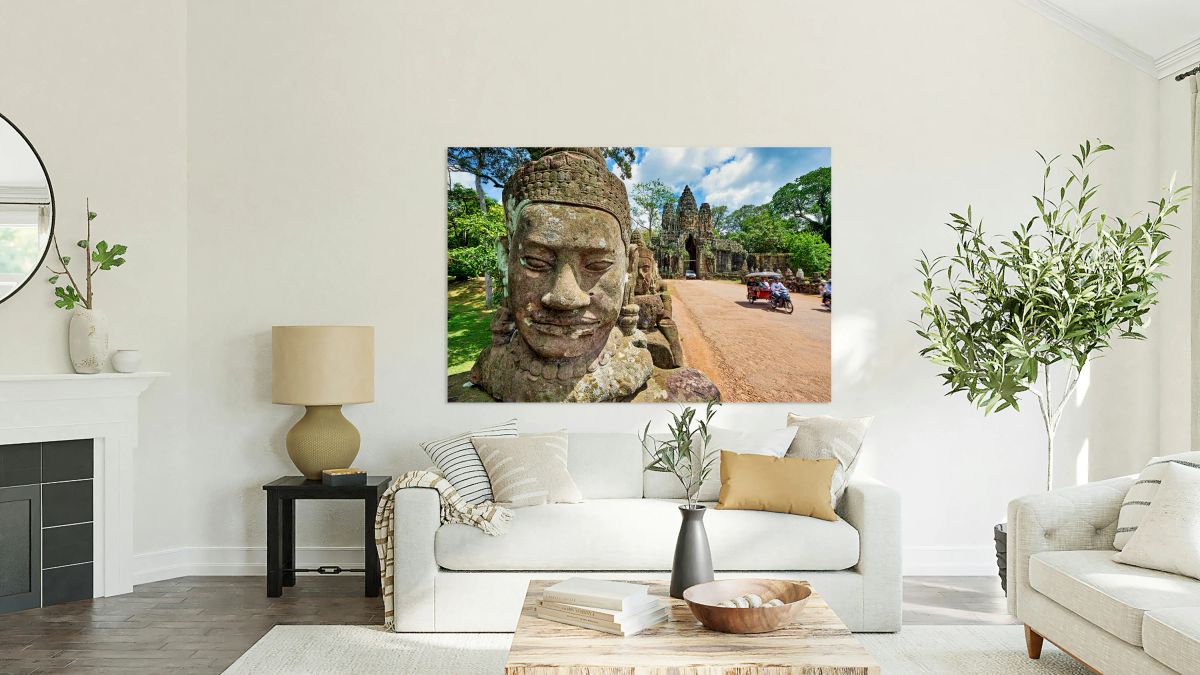 Ancient stone faces and grand temple gate at Angkor Thom.