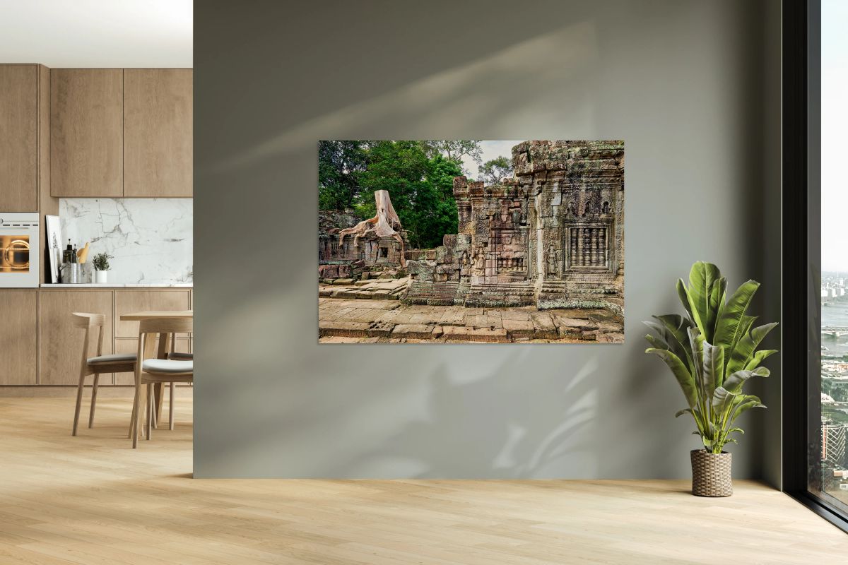 Ancient temple ruins consumed by giant tree roots.