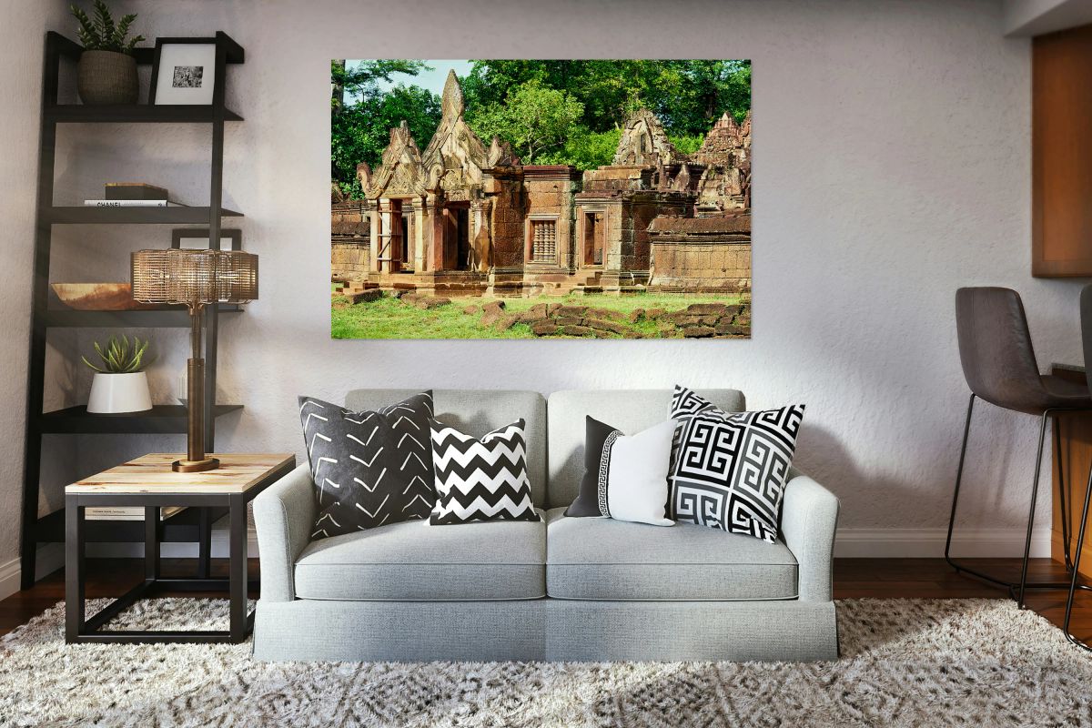 Ancient Banteay Srei temple ruins with intricate carvings and gr