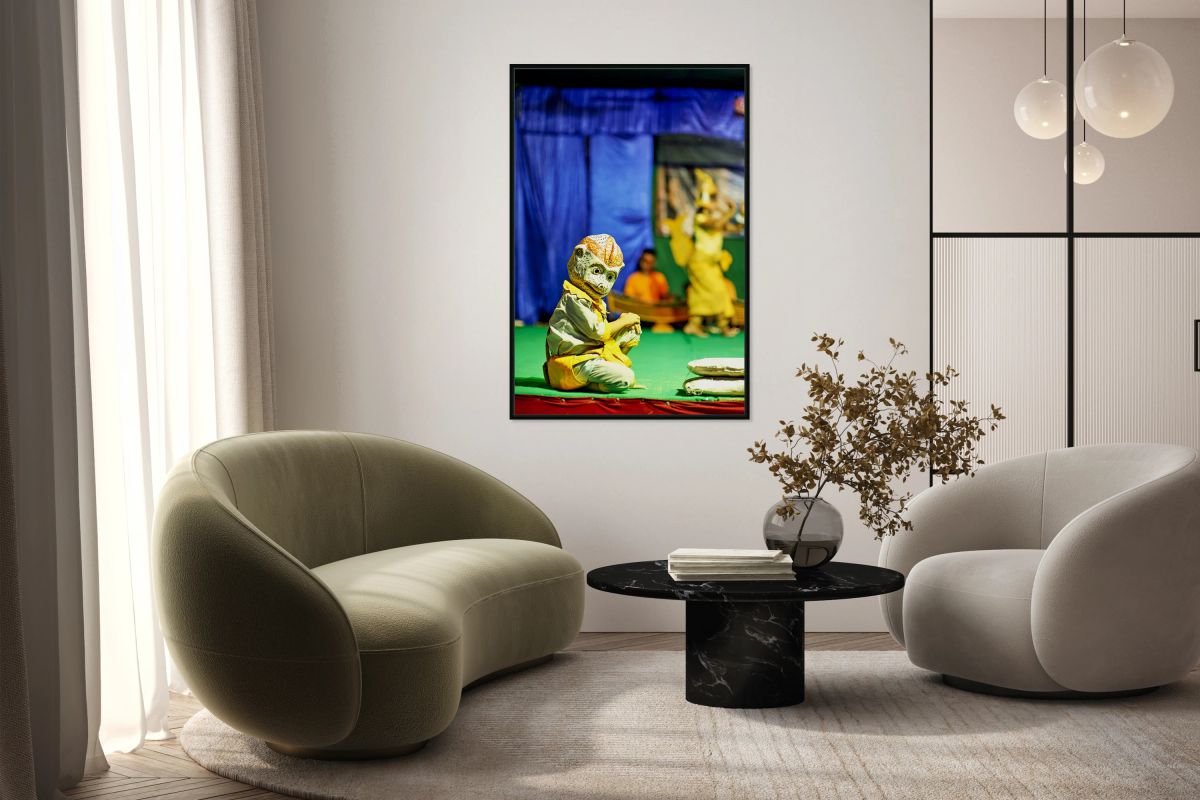 Traditional masked performer in monkey costume on stage.