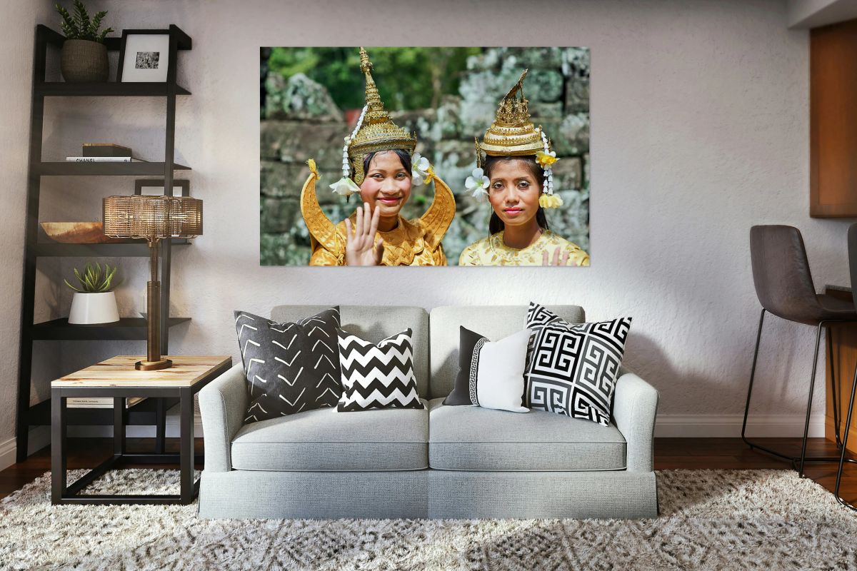 Cambodian dancers in golden attire and elaborate headwear.