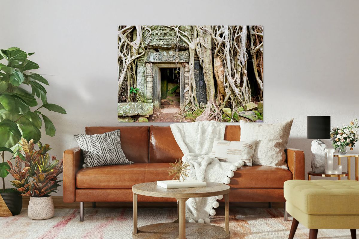 Ancient temple ruins consumed by massive tree roots.