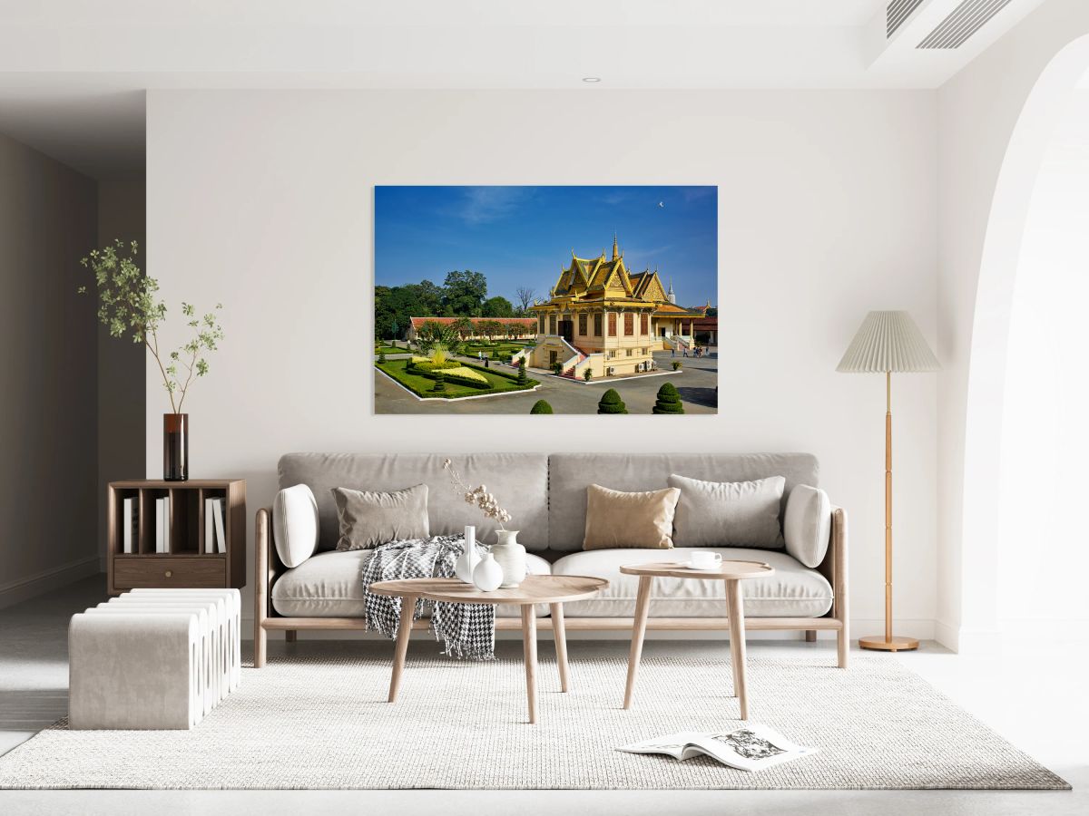 Golden roofed Cambodian palace manicured gardens and clear blu