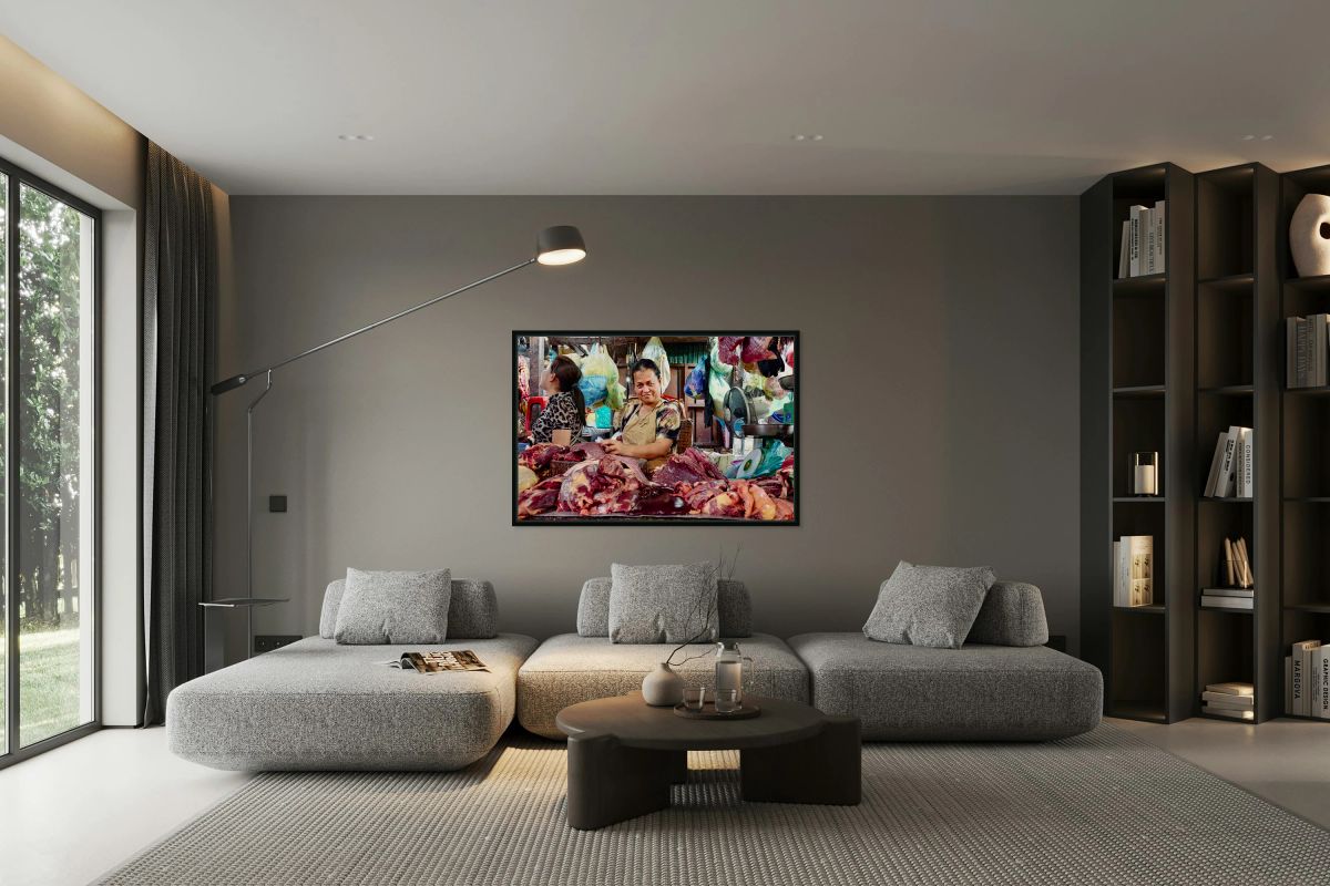 Market vendor with fresh meat display.