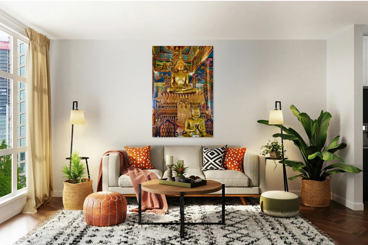 Ornate golden Buddha statue in a richly decorated temple.