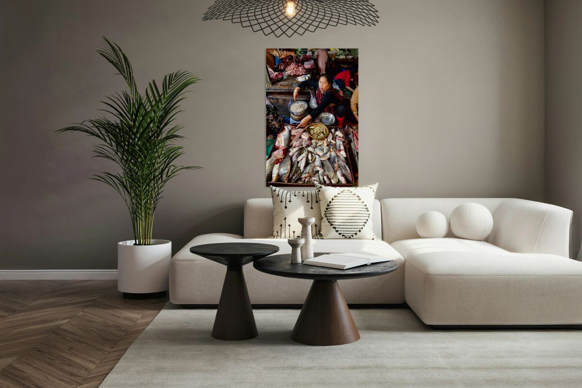 Asian market vendor selling fresh fish and meat.