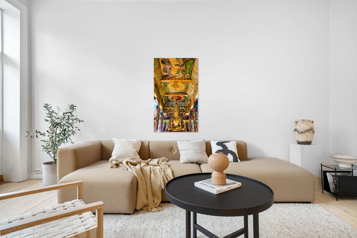 Golden Buddha statue surrounded by vibrant detailed temple mura