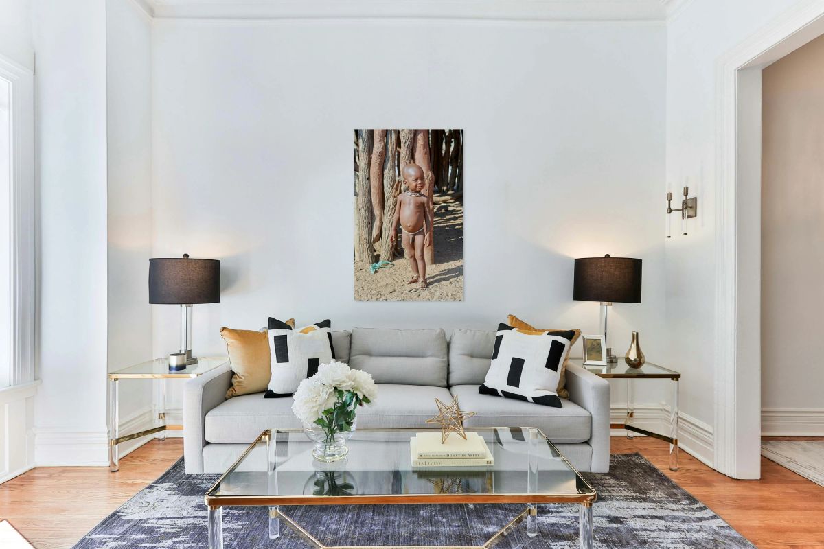 Child standing outside in a Himba village in Kunene Region Namib
