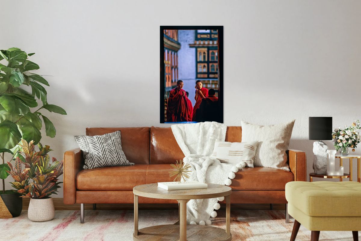 Bhutanese monks using a mobile phone.