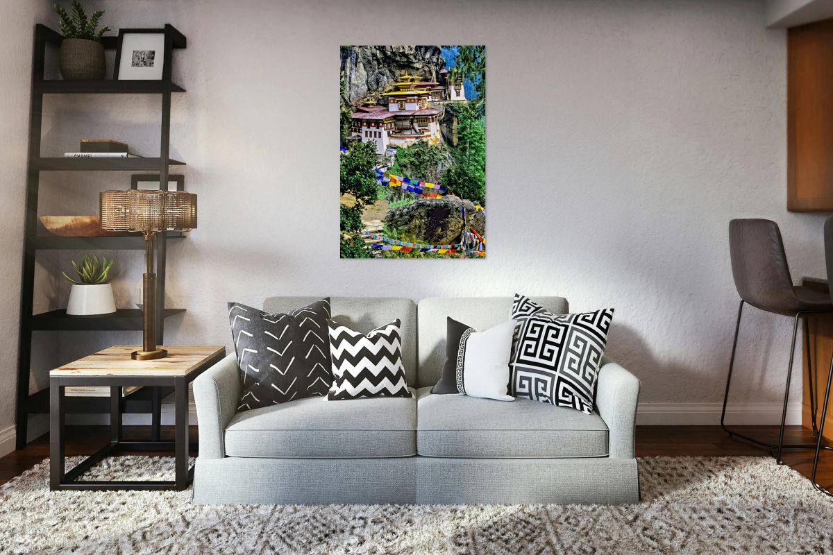 Iconic Bhutanese monastery on a cliff surrounded by prayer flag