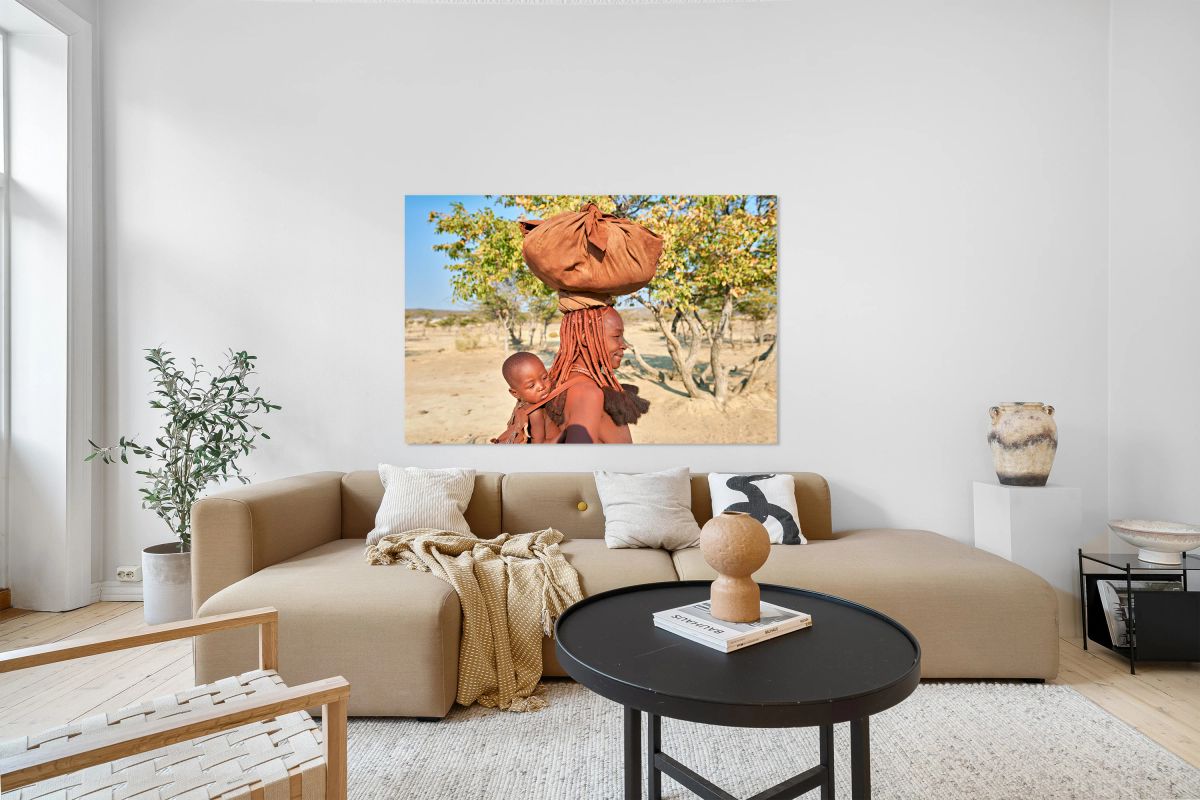 Portrait of Himba woman carrying her baby in Kunene region Nami