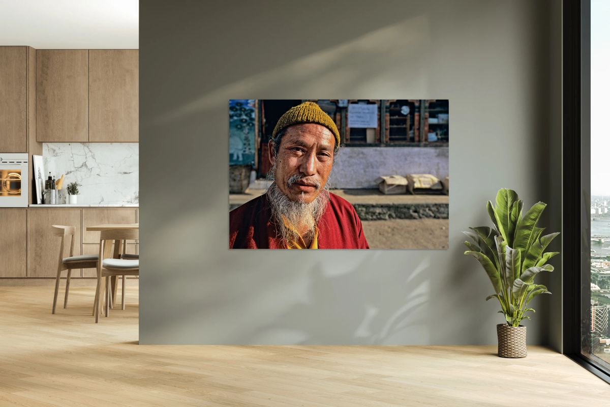 Portrait of a man with a long white beard and yellow beanie.