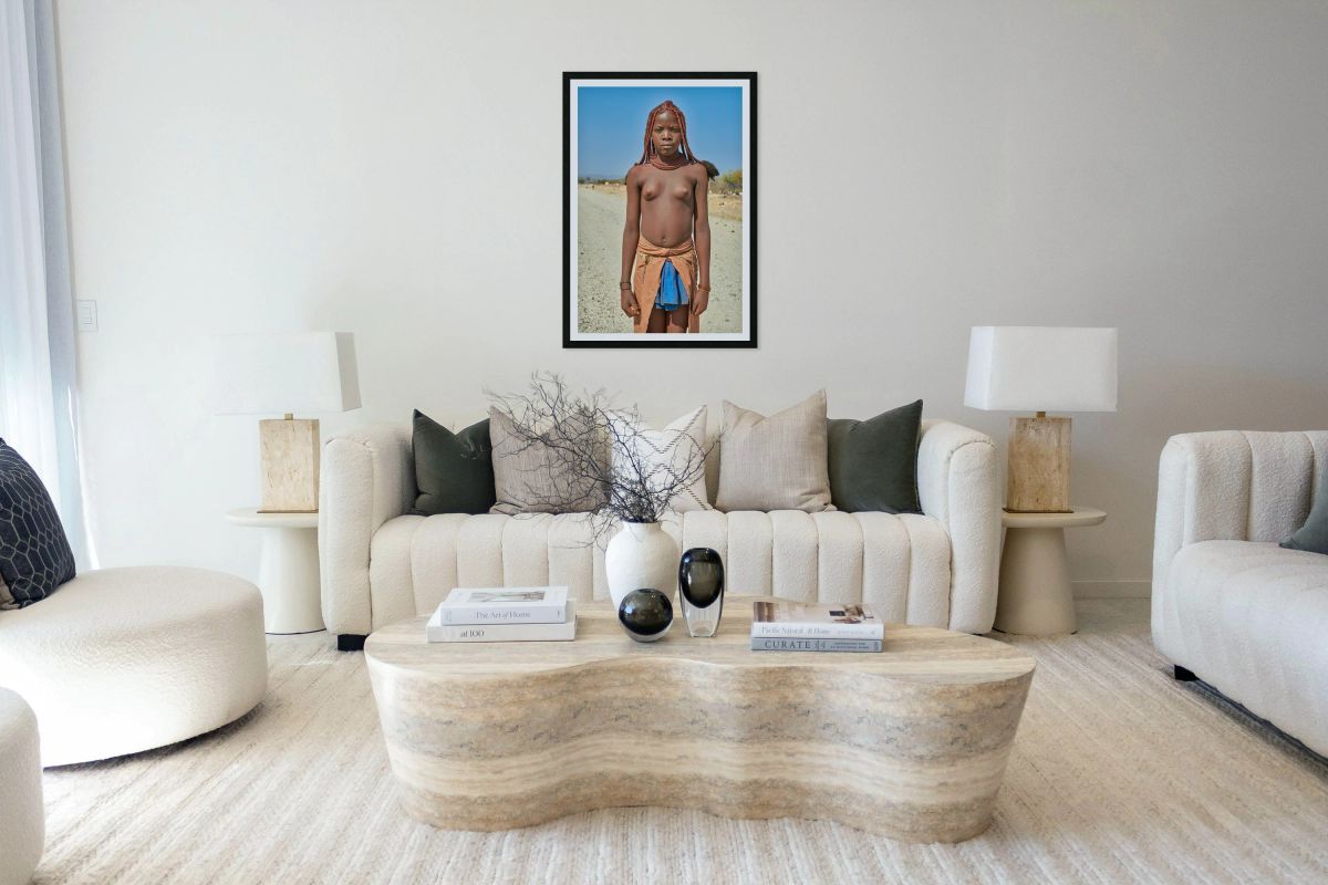 Himba woman standing on a road in Kunene region of Namibia