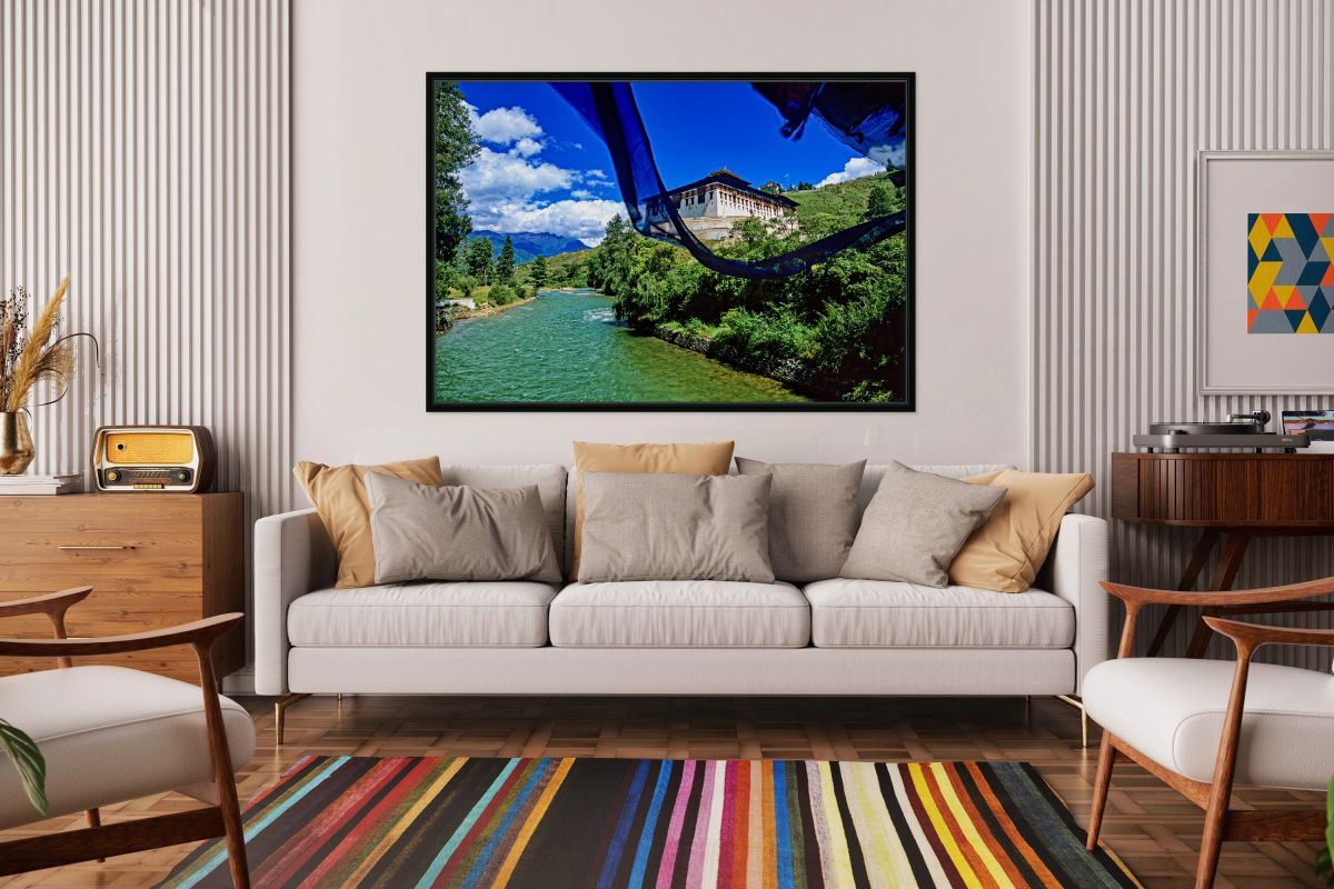 Bhutanese monastery river mountains and prayer flag.