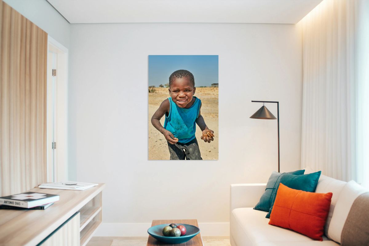 Joyful boy in Kavango Region of Namibia enjoys a moment outside