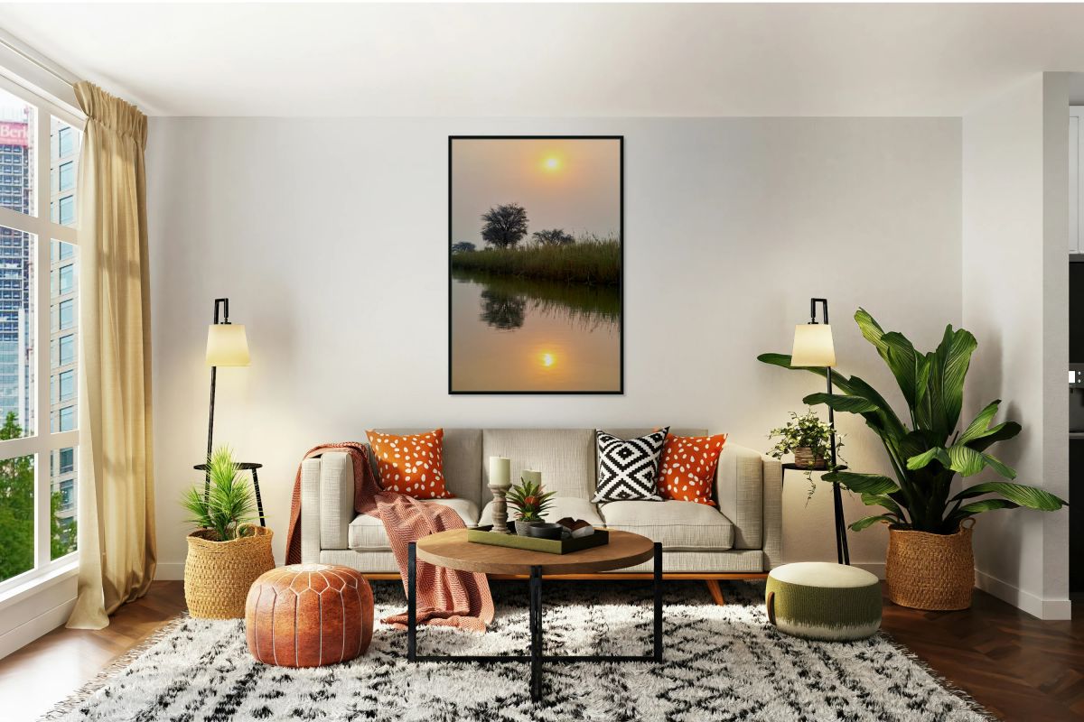 Banks of Okavango River at dusk in Namibia with reflections