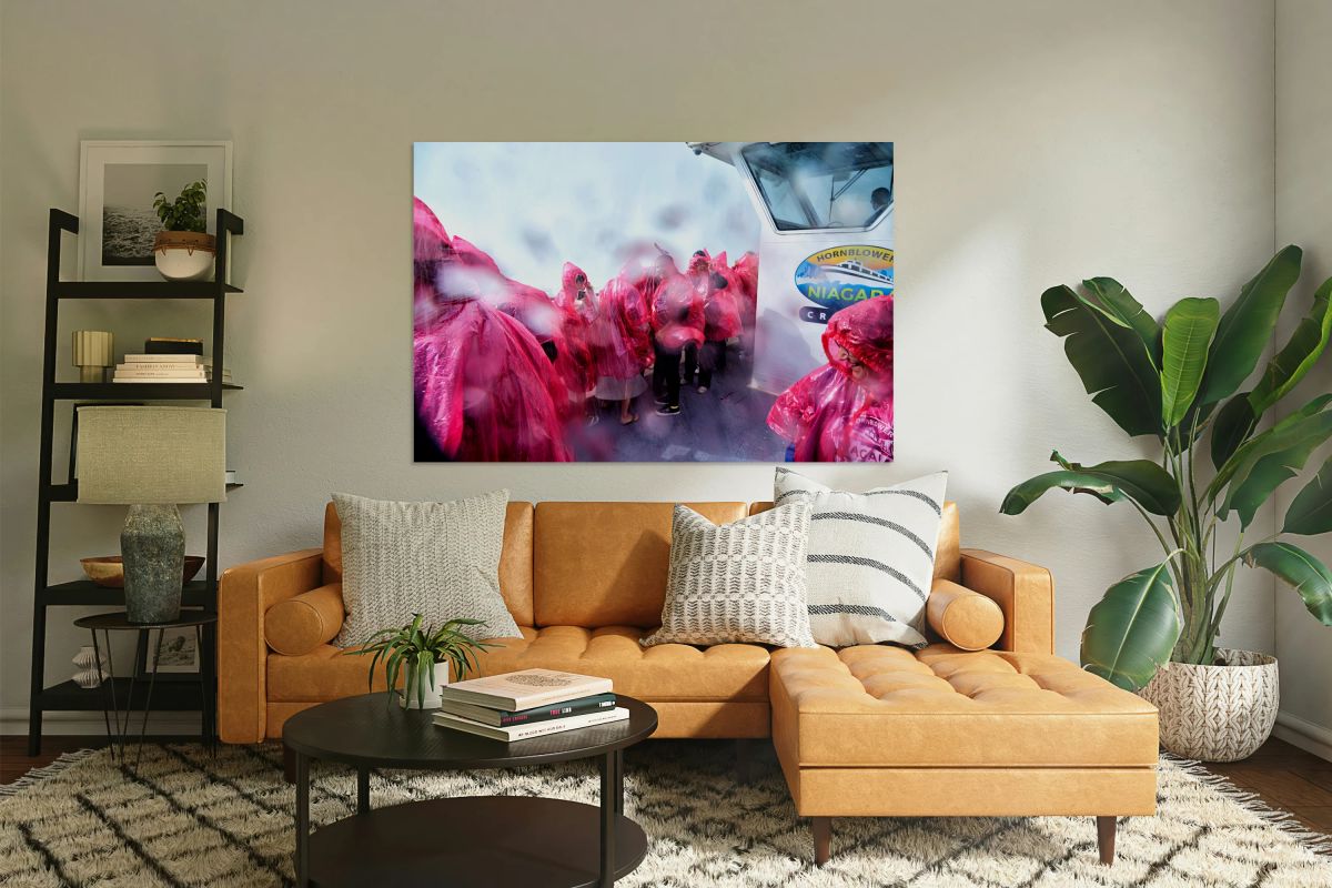 Pink ponchoed tourists on a misty Hornblower Niagara Falls cruis