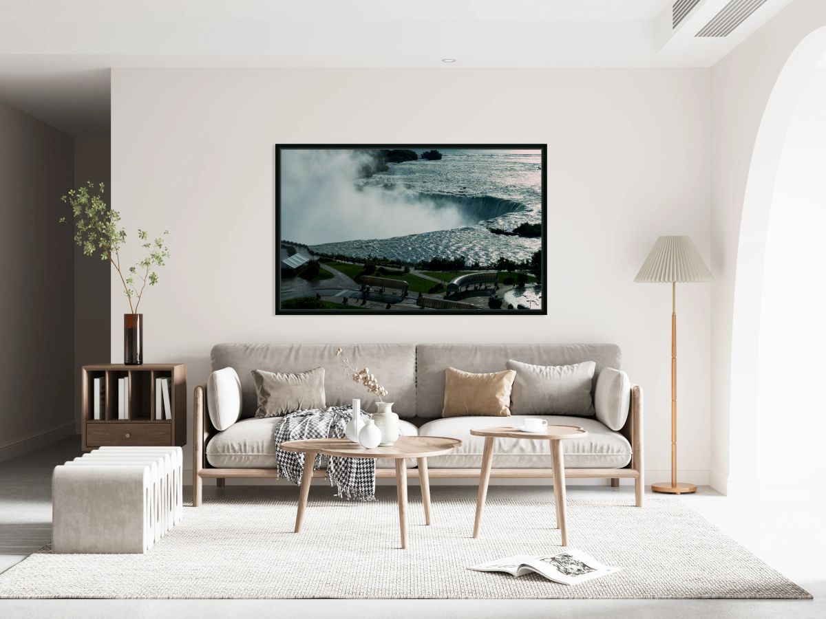 Niagara Falls with powerful water mist and surrounding park.