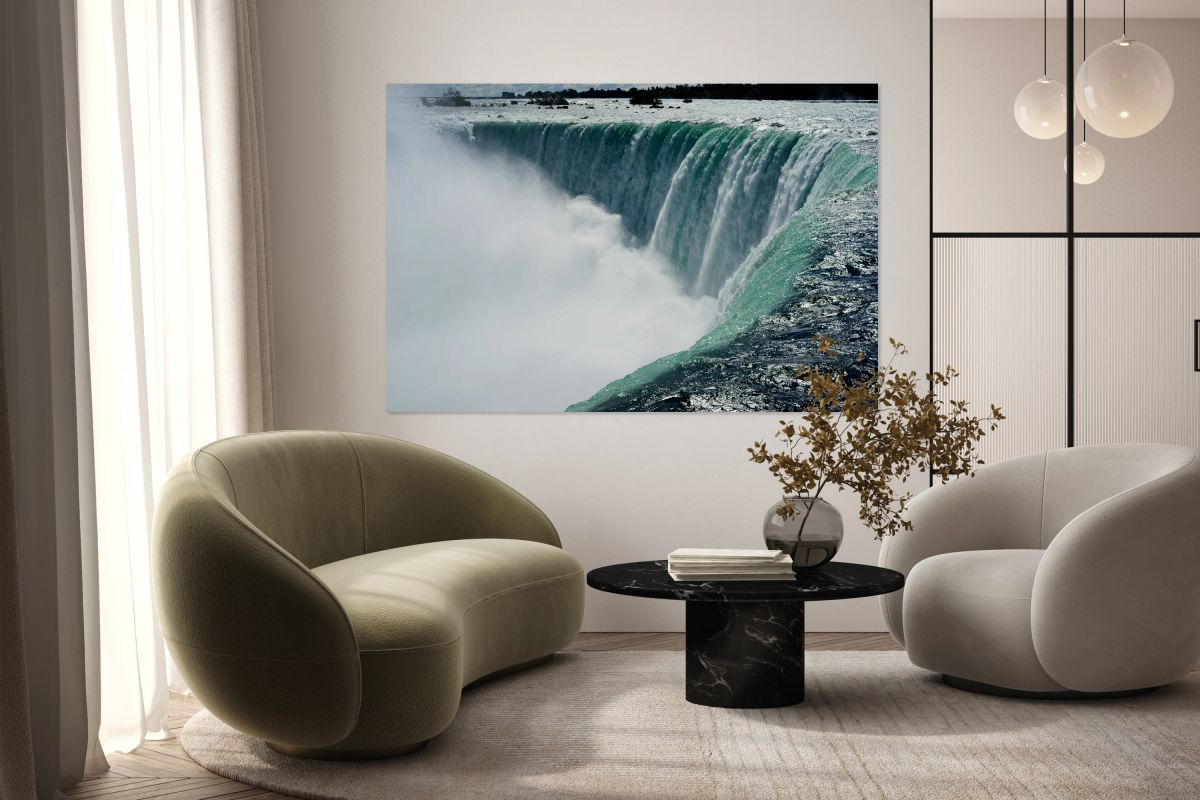 Powerful Niagara Falls cascading creating immense mist.