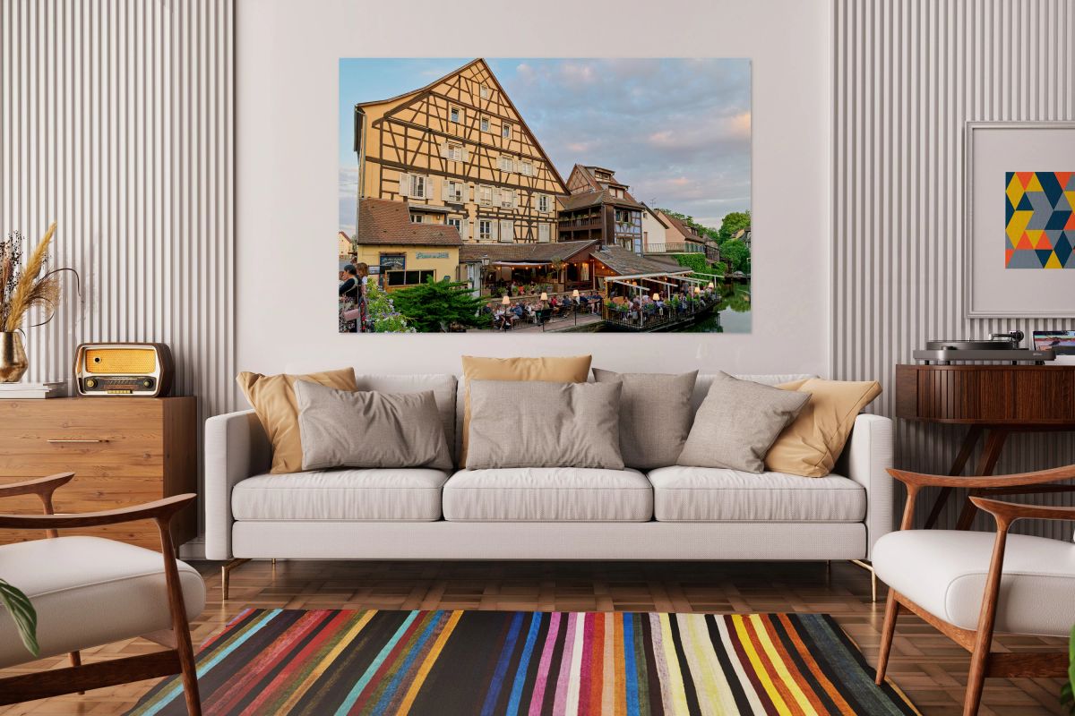 Dining by the canal in Colmar with timber framed houses in view