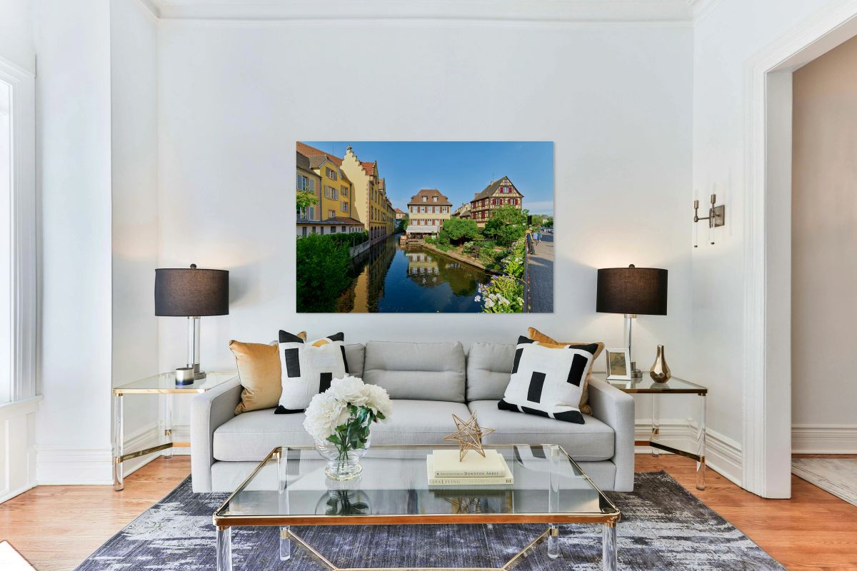 Visitors enjoy sunny day by canals in Colmar France