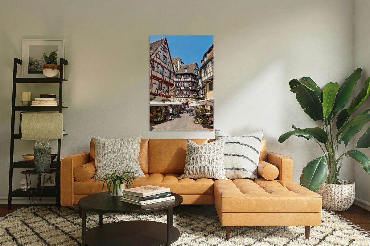 Timber framed houses in old town of Colmar with market stalls