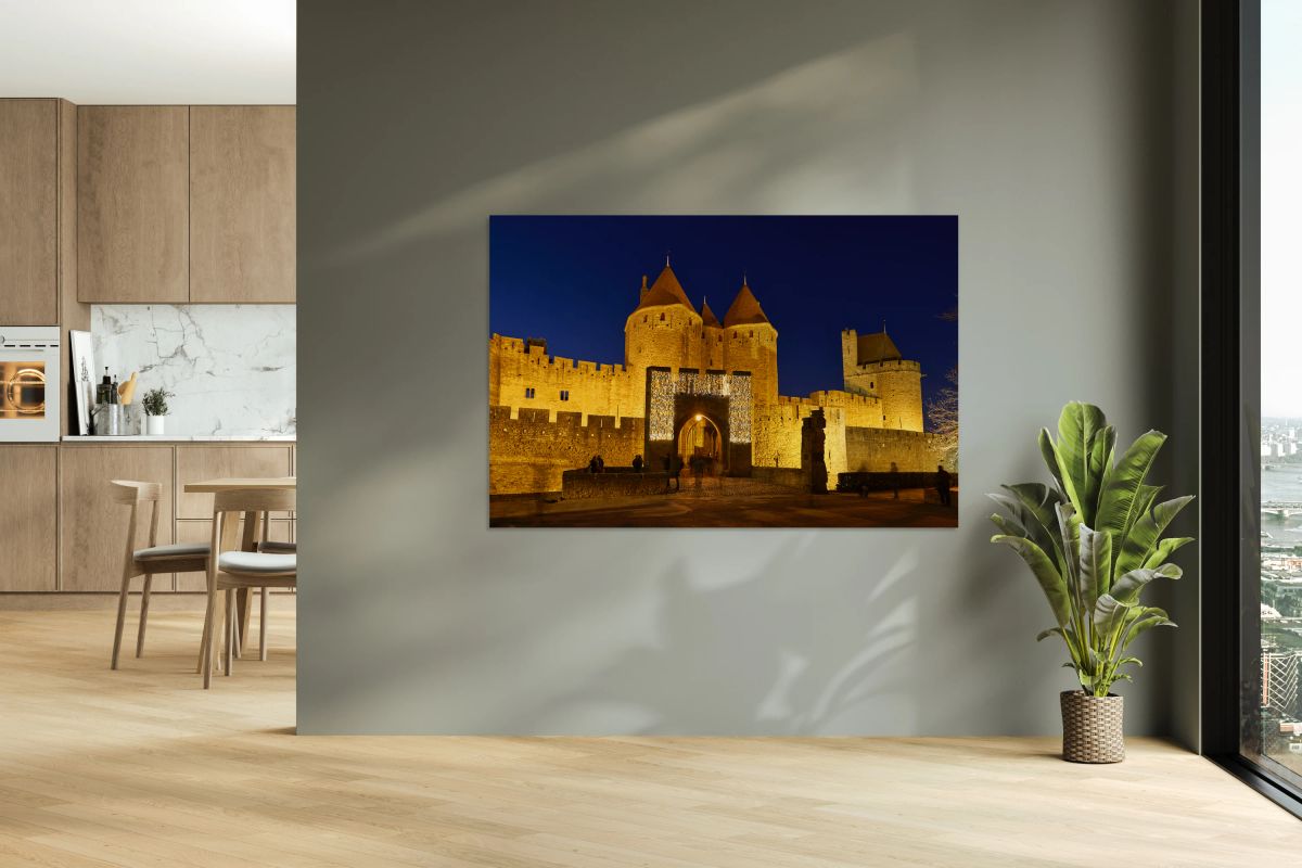 Visit to Carcassonne castle at night with lights around entryway