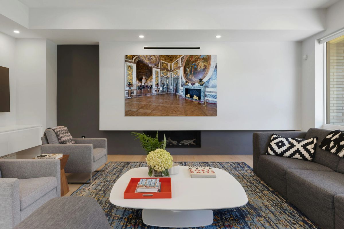 Visitors explore the halls of the Palace of Versailles in France